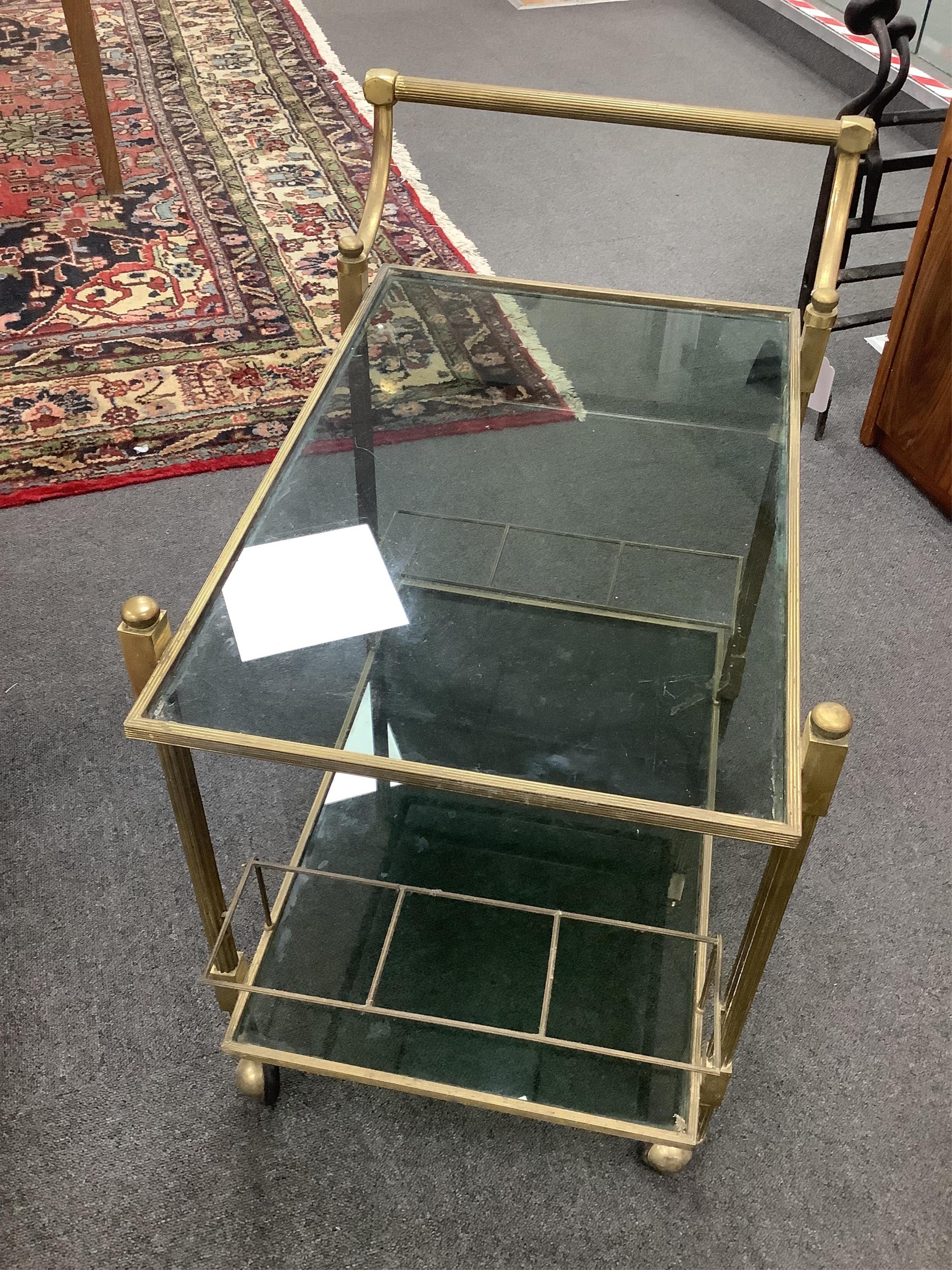 A brass two tier drinks trolley, width 44cm, depth 64cm, height 72cm. Condition - fair